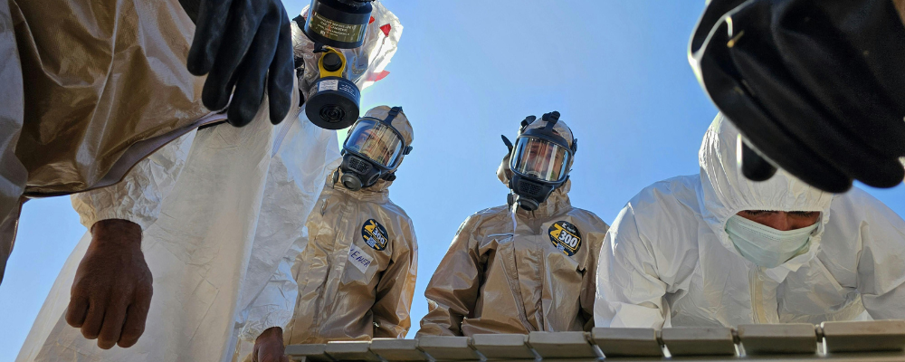 Safety professionals evaluating manufacturing equipment during a process hazard analysis